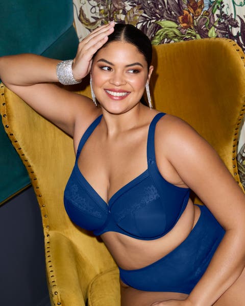 A woman wearing a blue bra.
