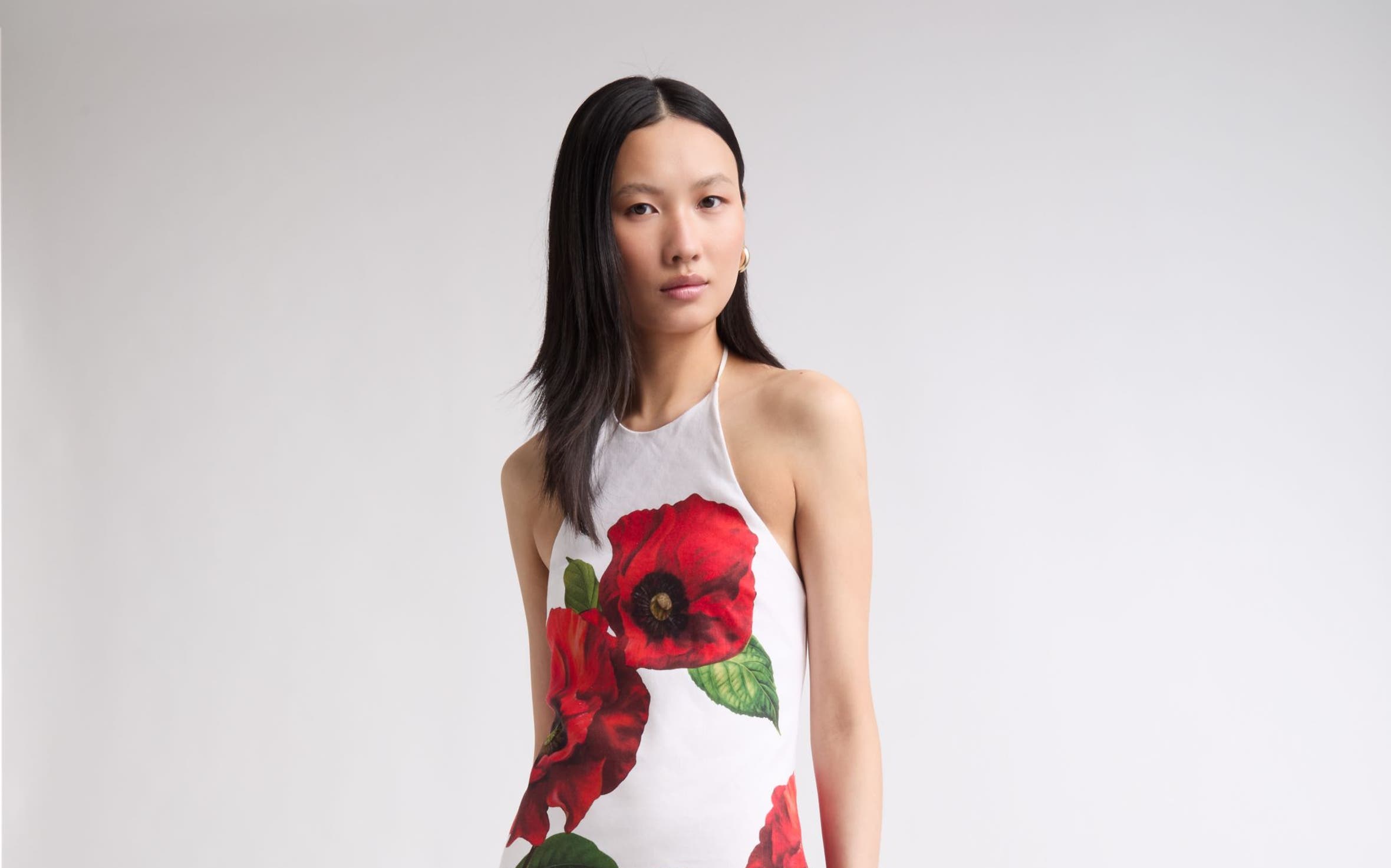 A woman wearing a cocktail dress.