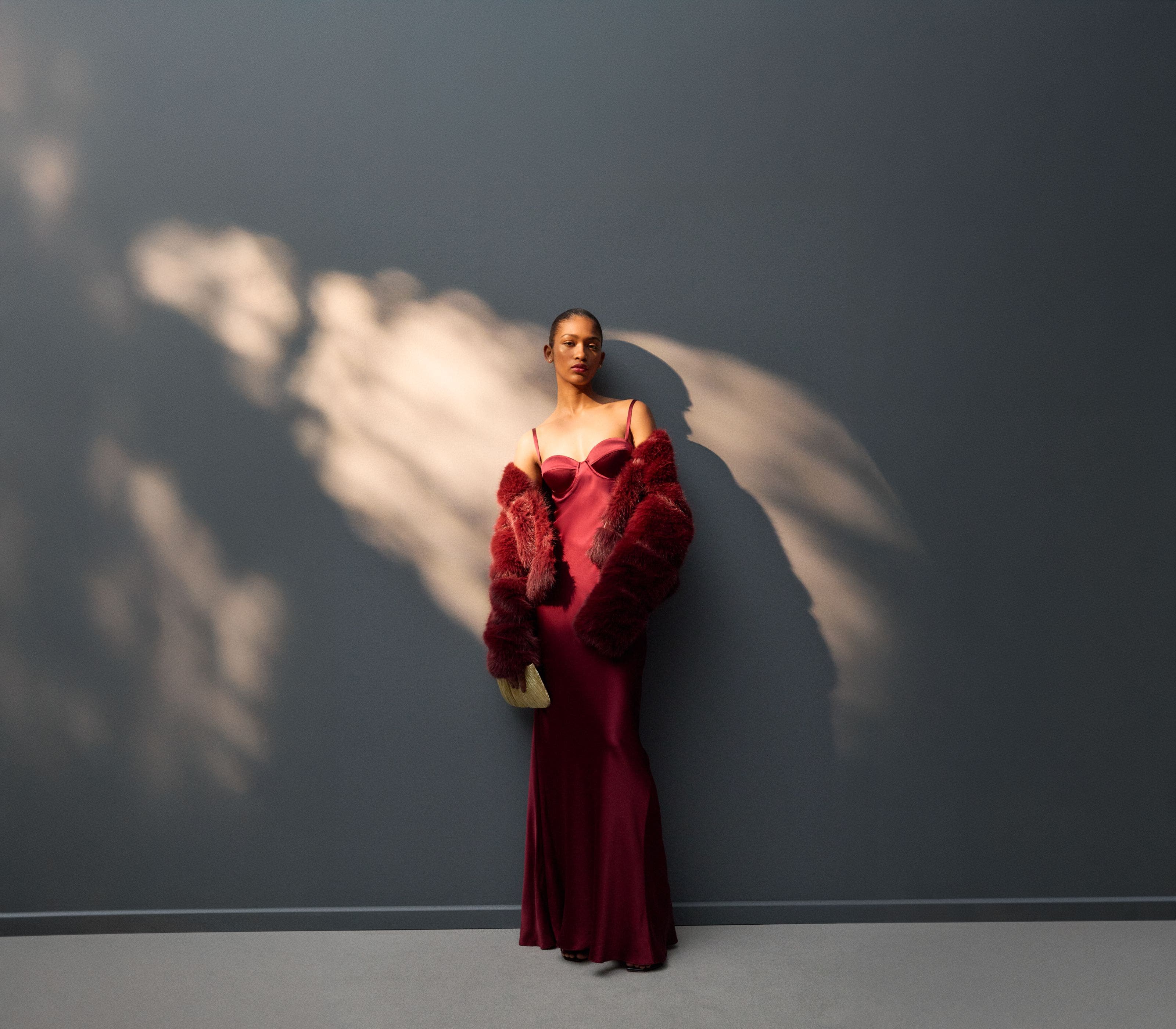 woman wearing a burgundy long dress.