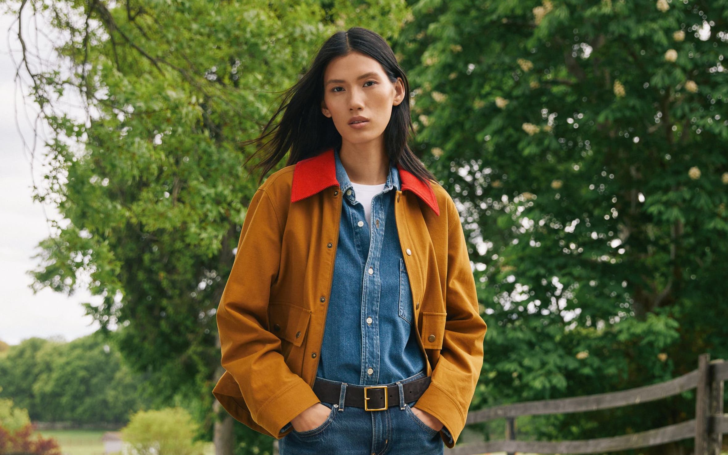 A woman wearing fall clothing.