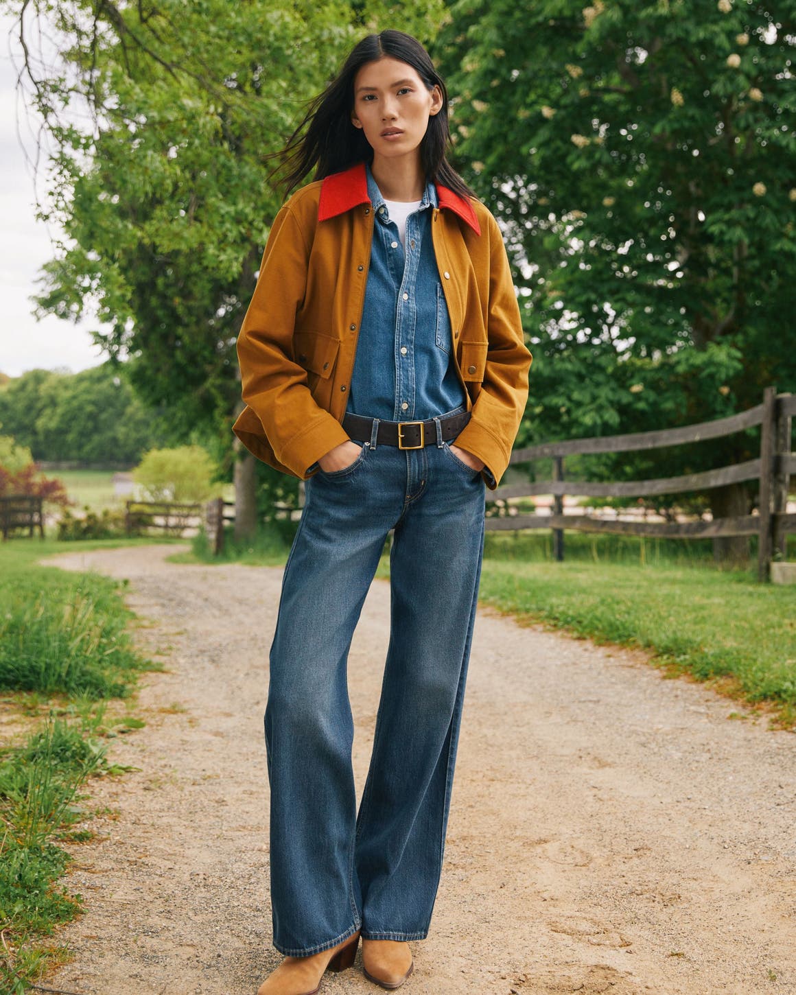 A woman wearing fall clothing.