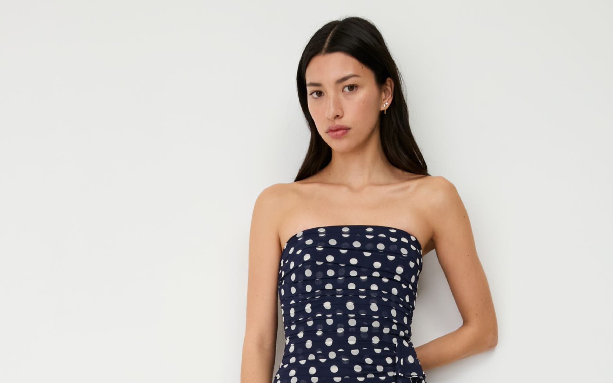 A woman wearing a patterned dress.