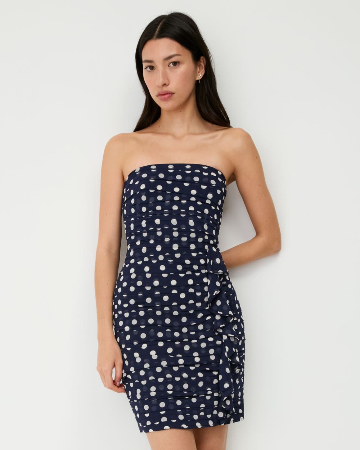 A woman wearing a patterned dress.