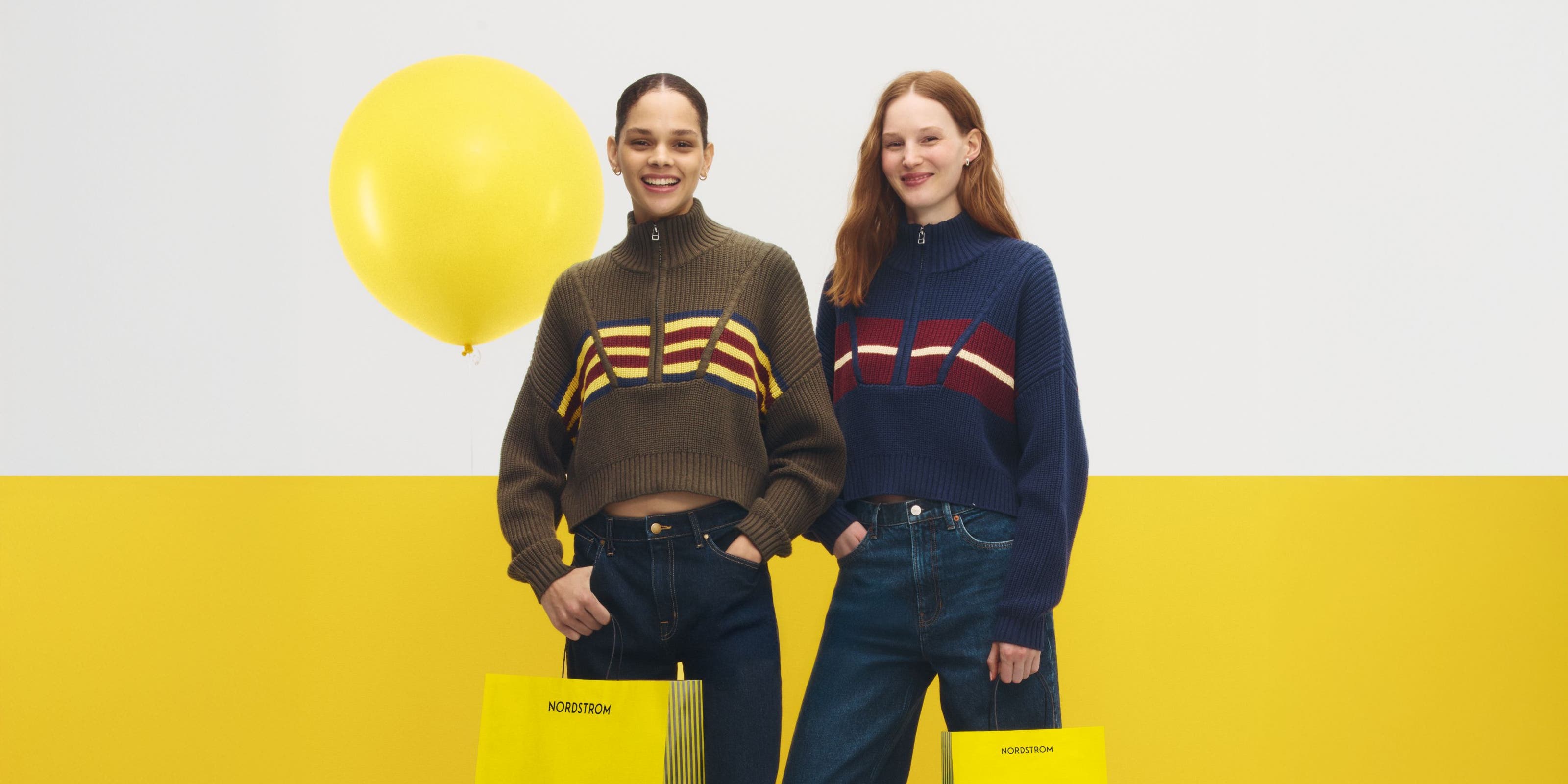 two women with Anniversary sale shopping bags