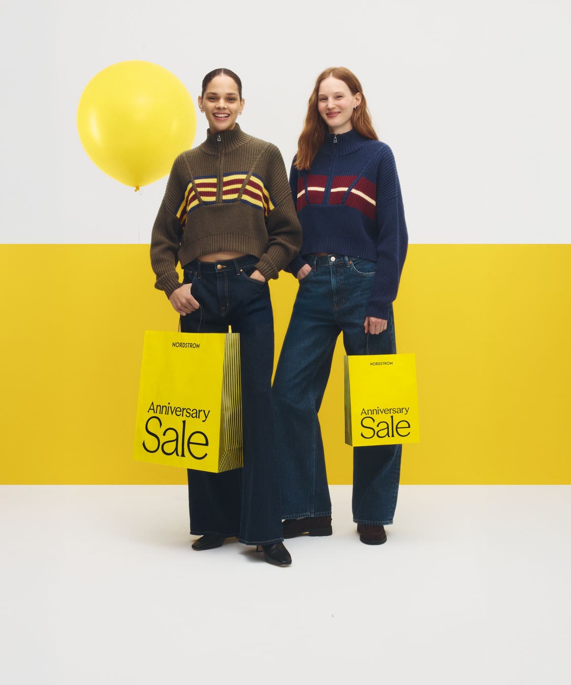 two women with Anniversary sale shopping bags
