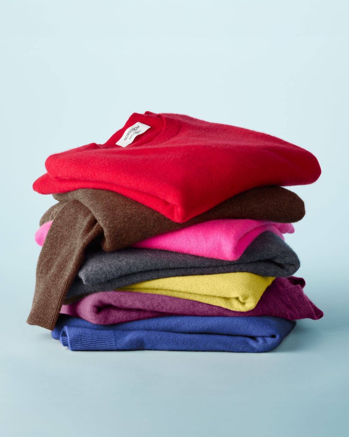 A stack of folded sweaters.