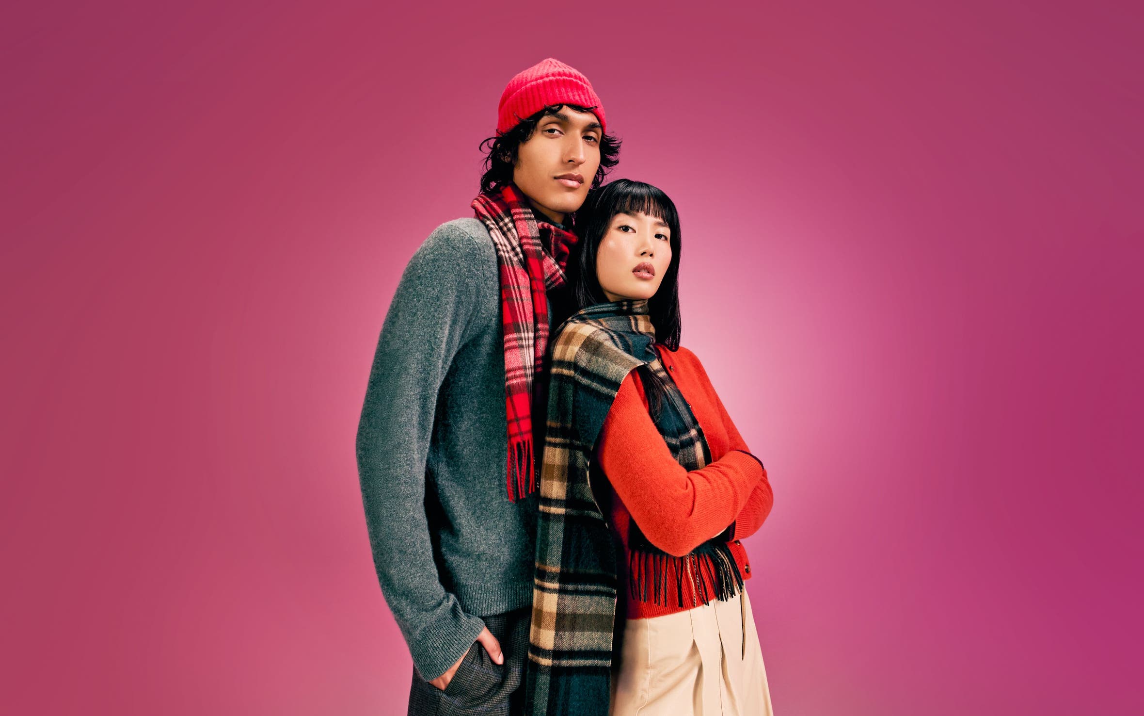 A man and a woman wearing cashmere sweaters.