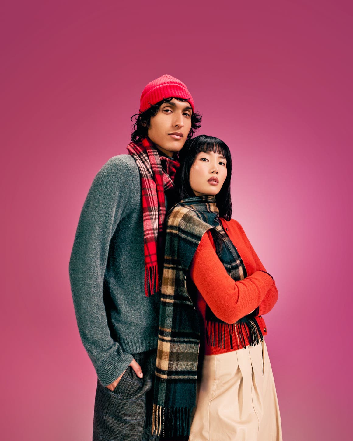 A man and a woman wearing cashmere sweaters.