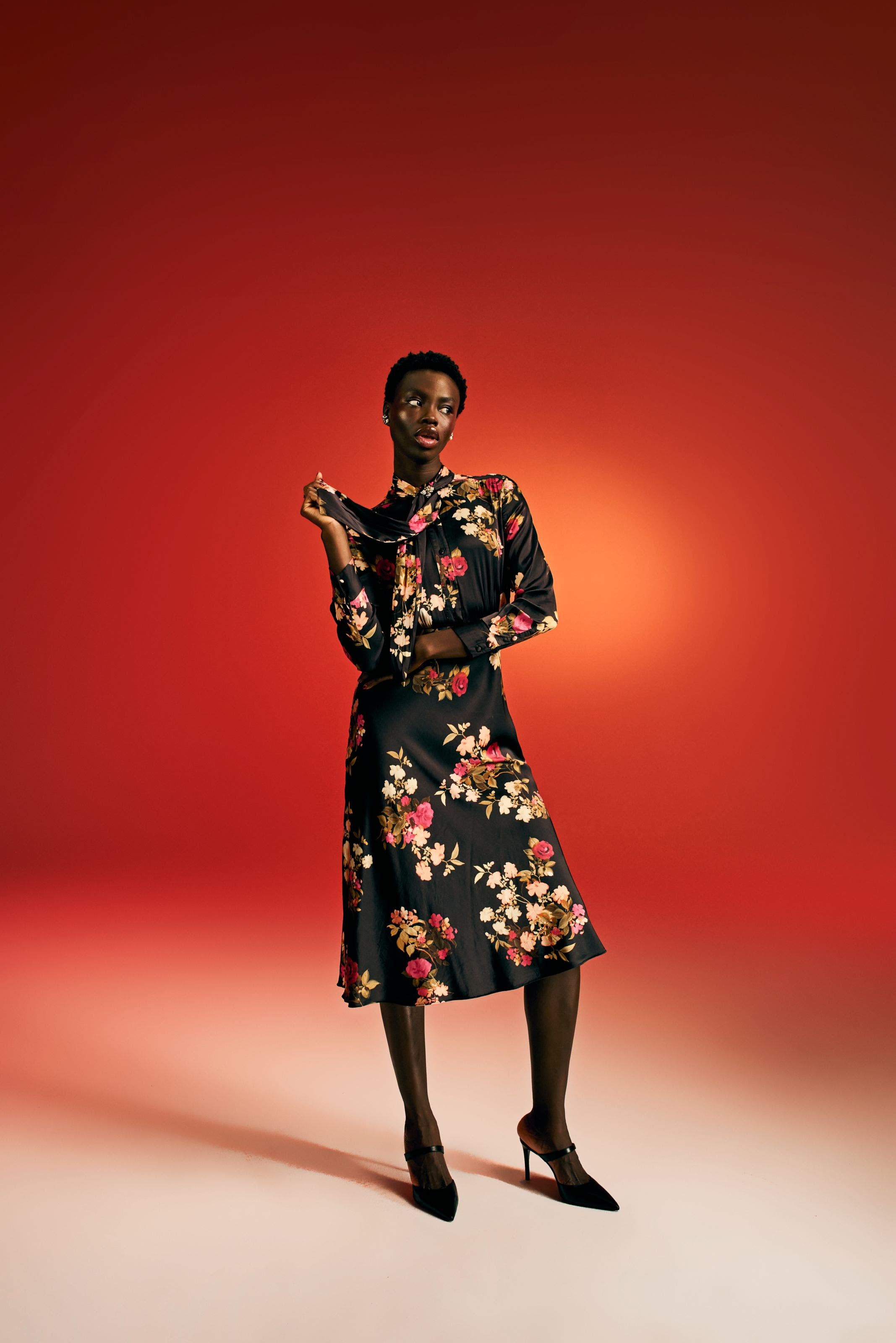 Woman in floral dress.