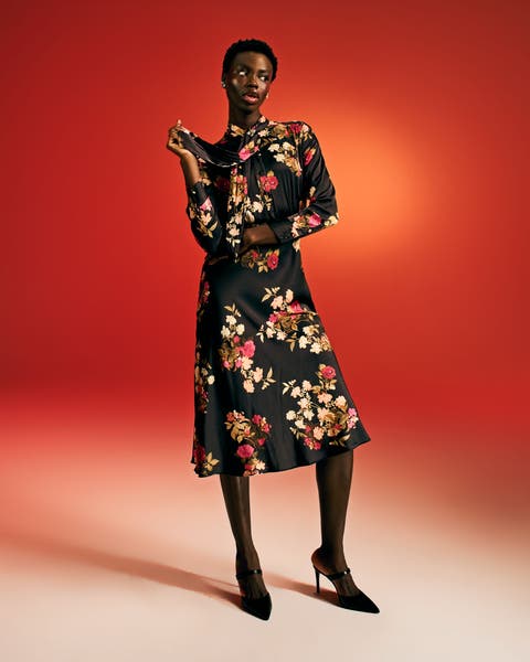 Woman in floral dress.