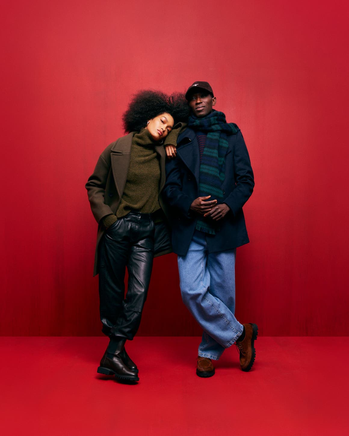 Woman and man wearing cold-weather looks.