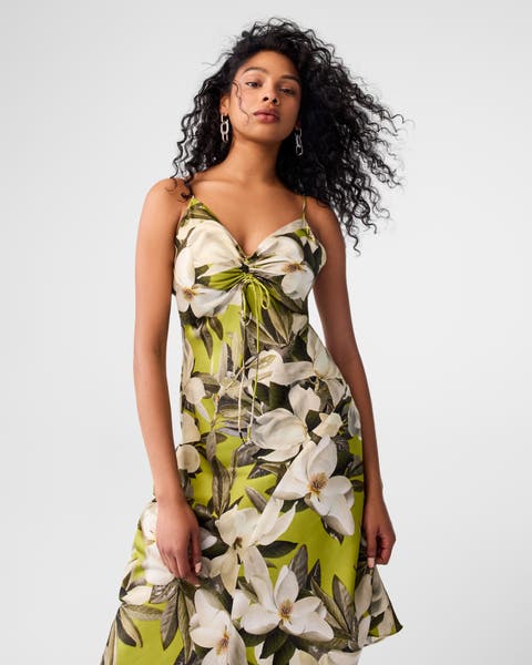 A woman wearing a floral sundress.