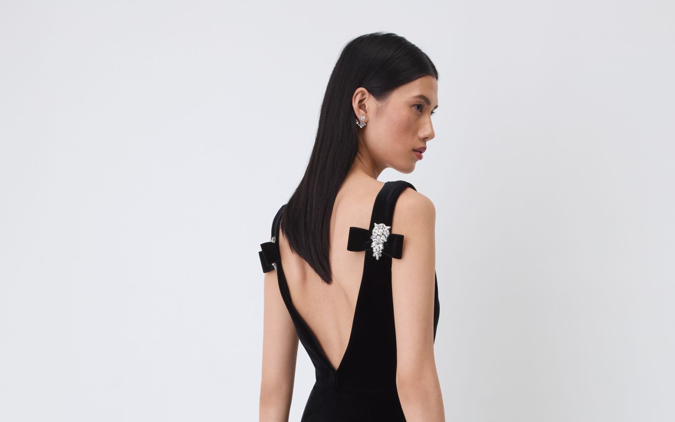 A woman wearing a black gown.