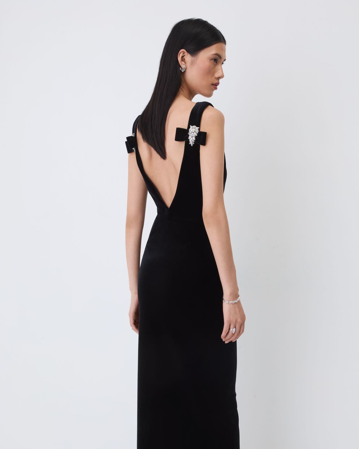 A woman wearing a black gown.