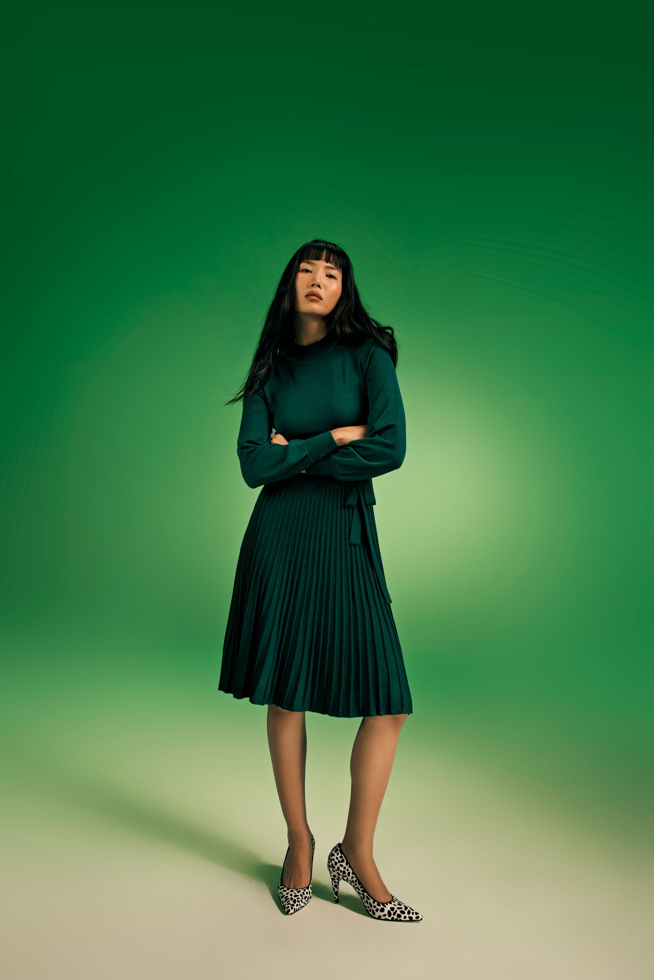 Woman in a green sweater dress.