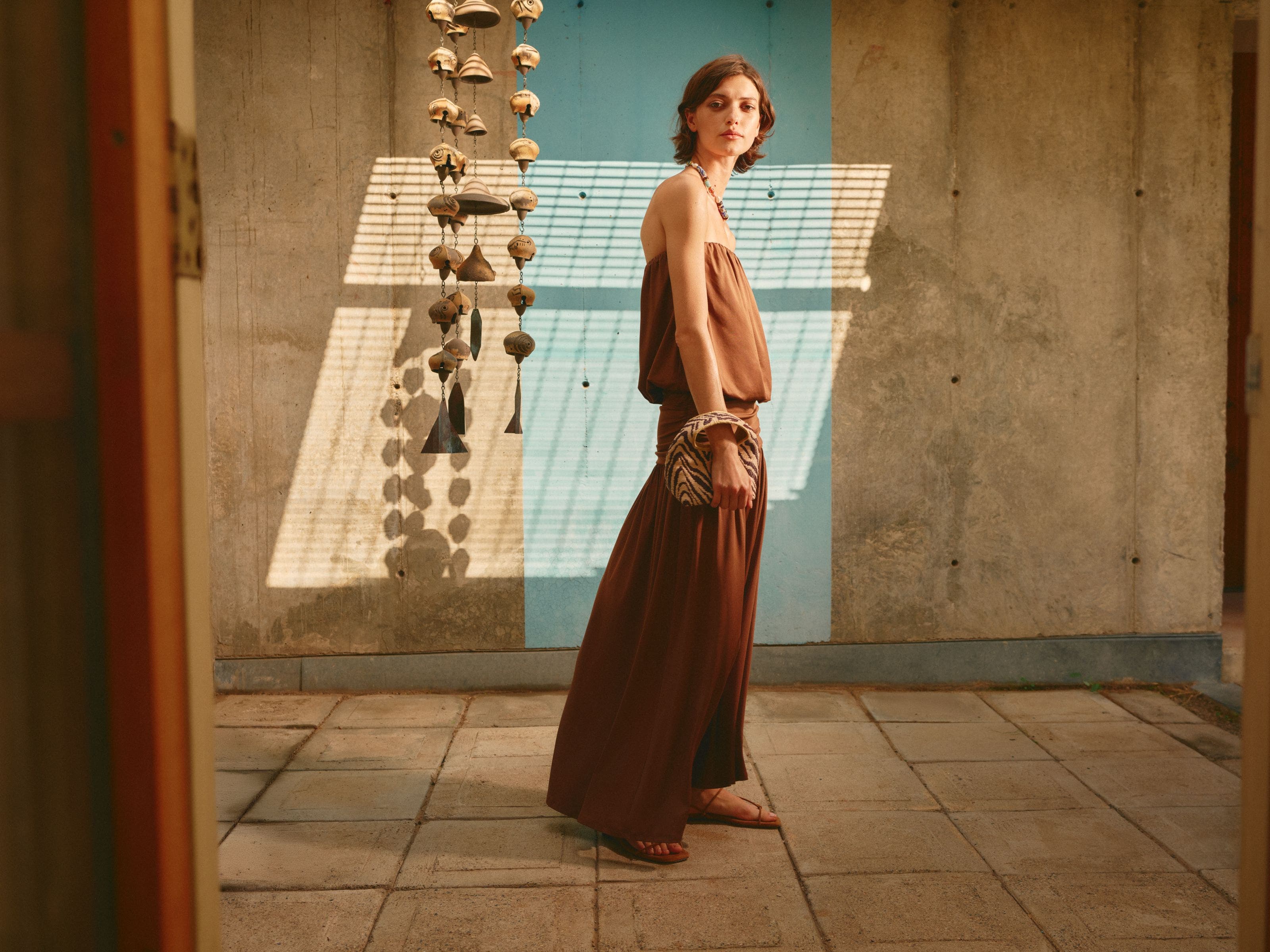 Woman wearing a strapless maxi dress.