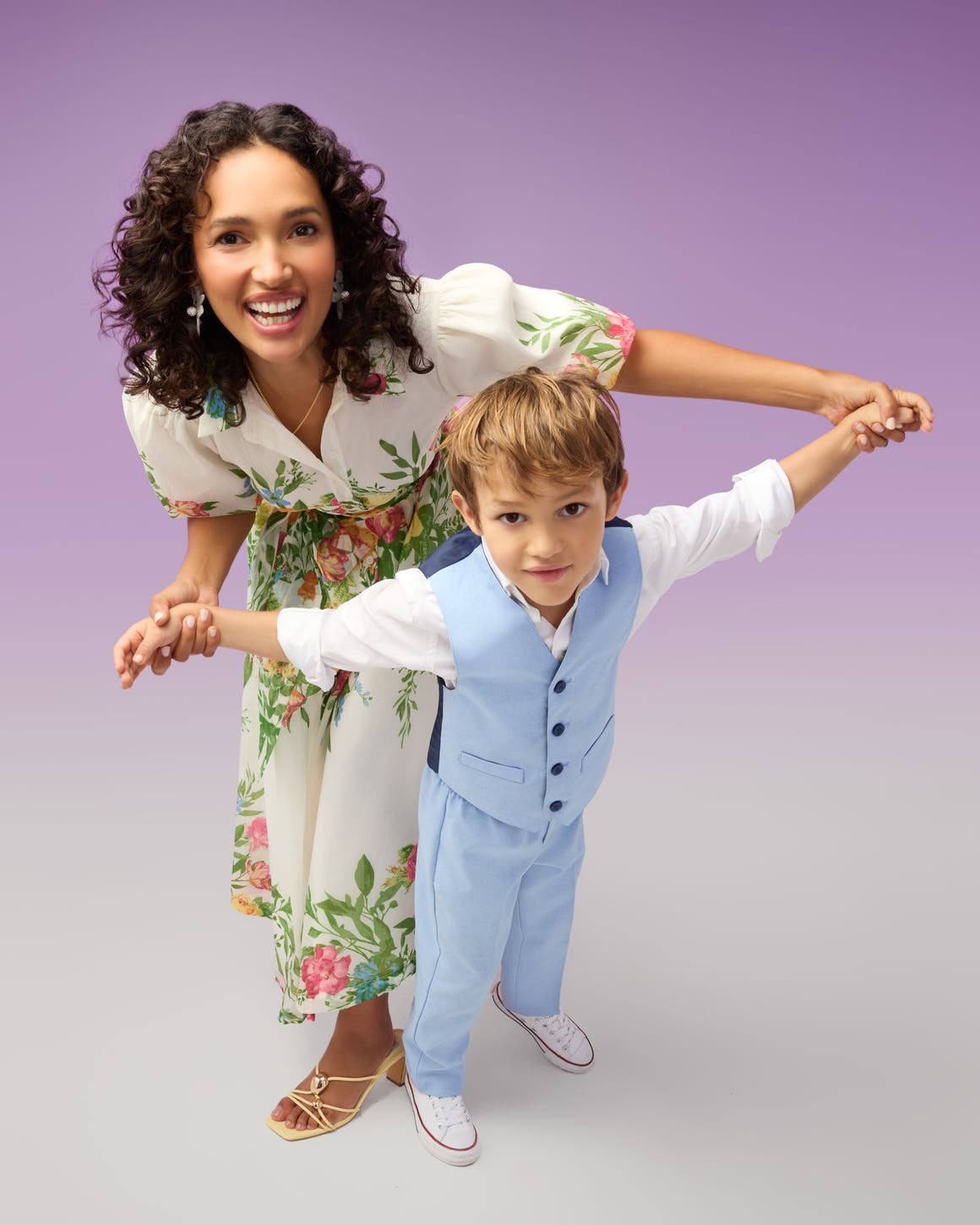 A woman and young boy in dressy spring outfits.