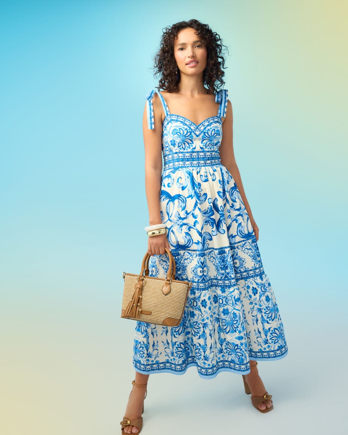 A woman in a blue and white dress.