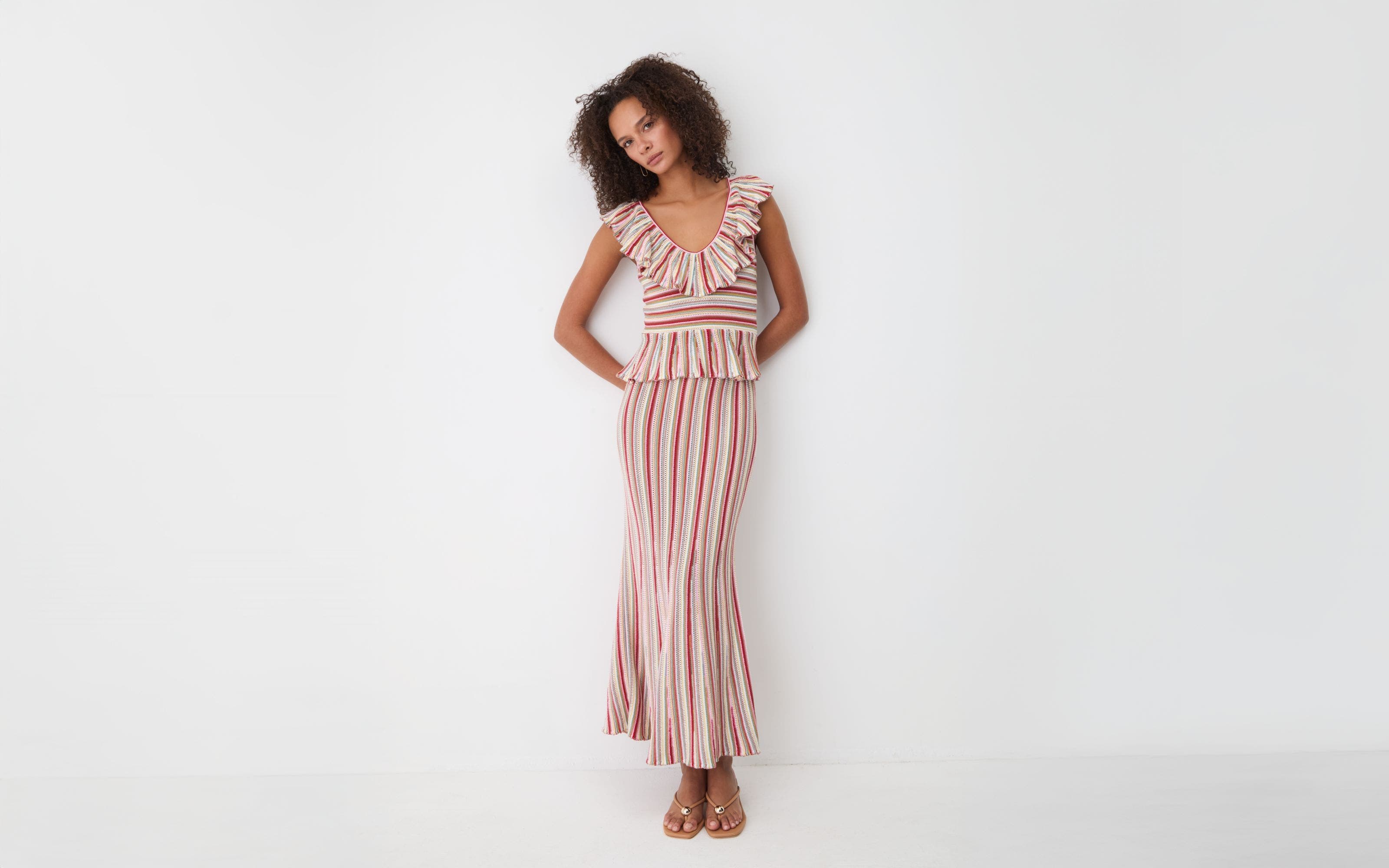 A woman wearing a striped dress.