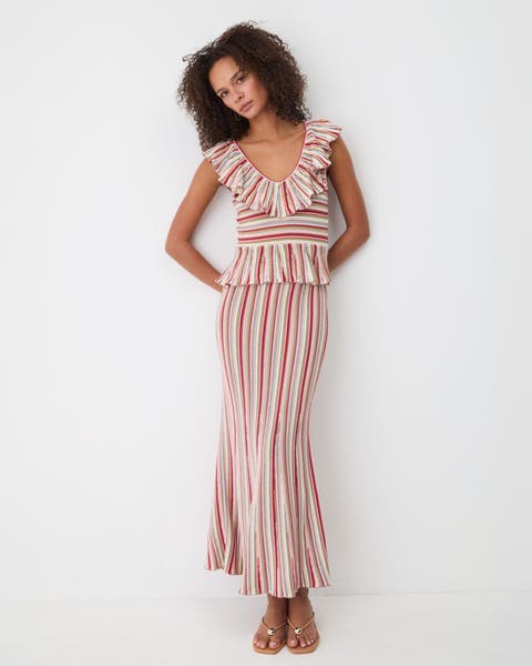 A woman wearing a striped dress.