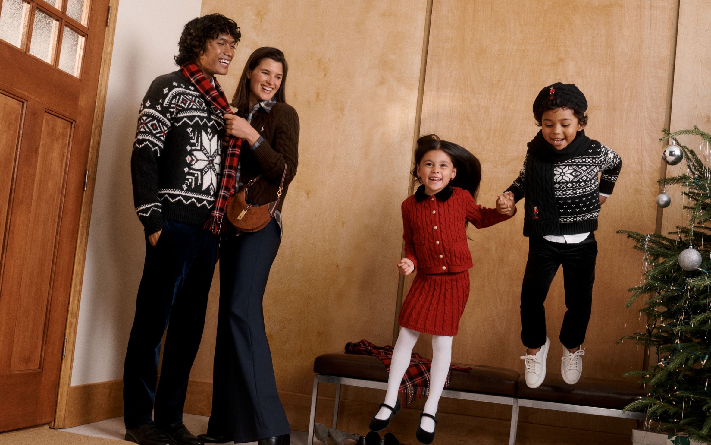 A man, woman and kids wearing Polo Ralph Lauren.