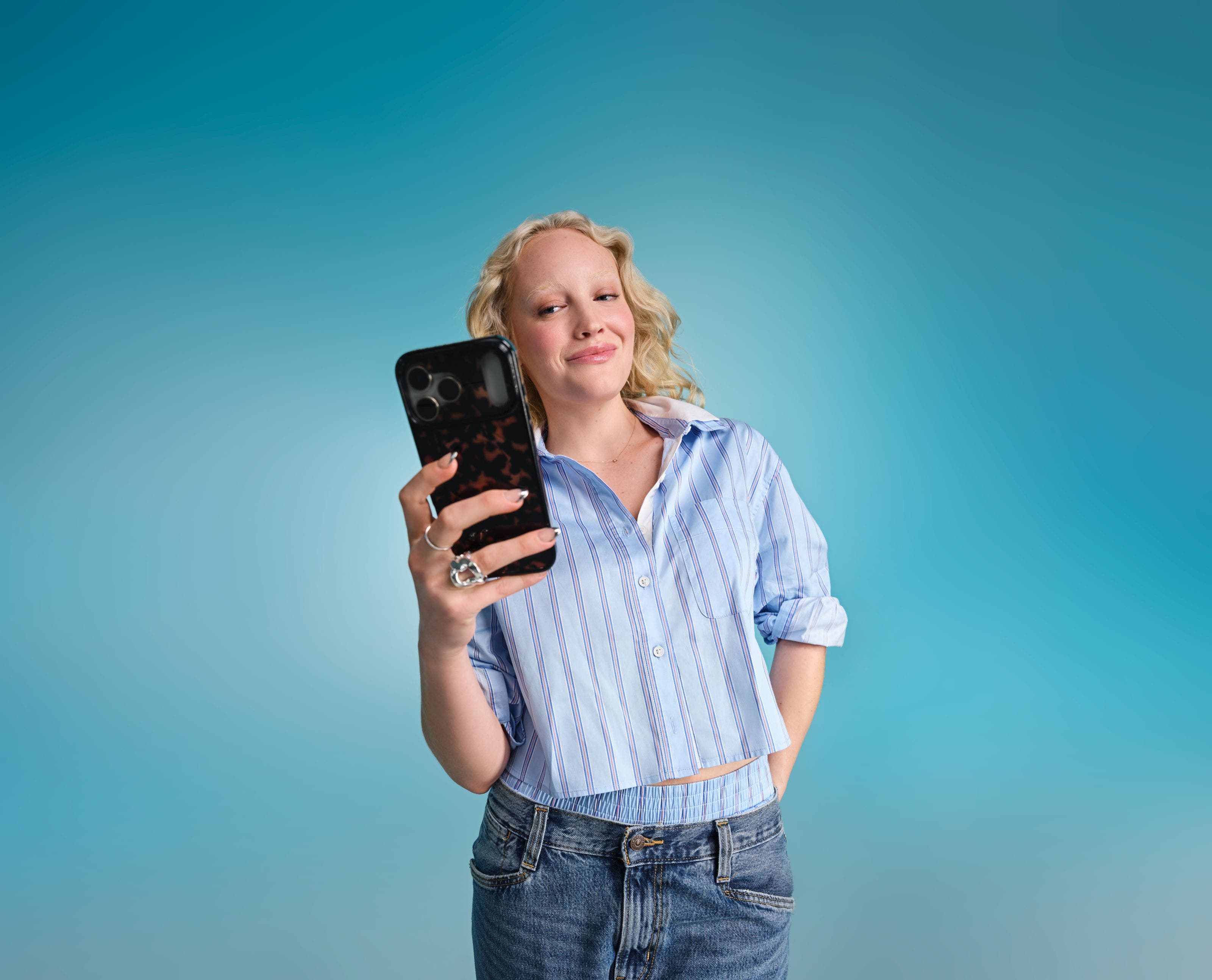 A woman holding a cell phone.