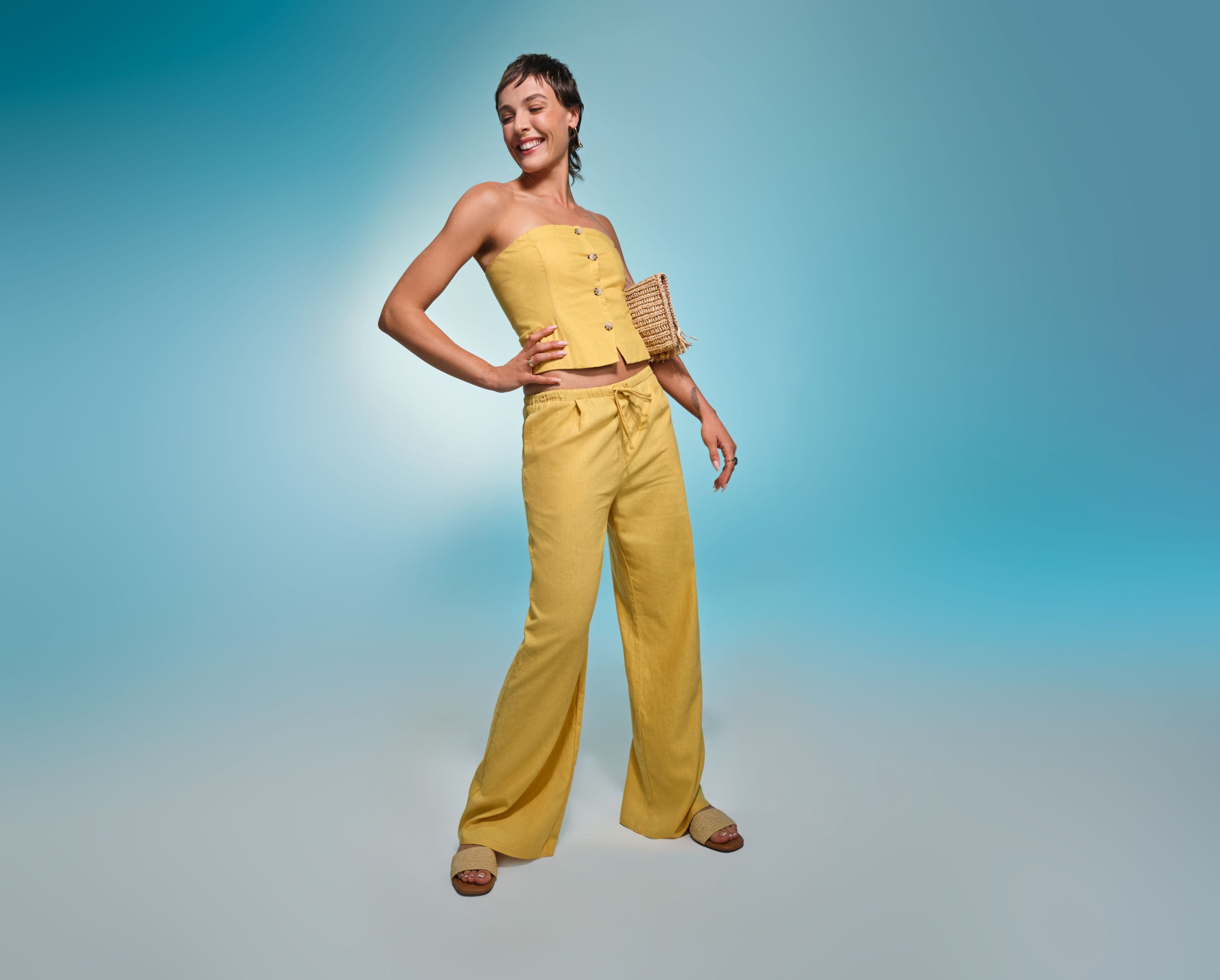 Woman wearing yellow top and yellow pants. 