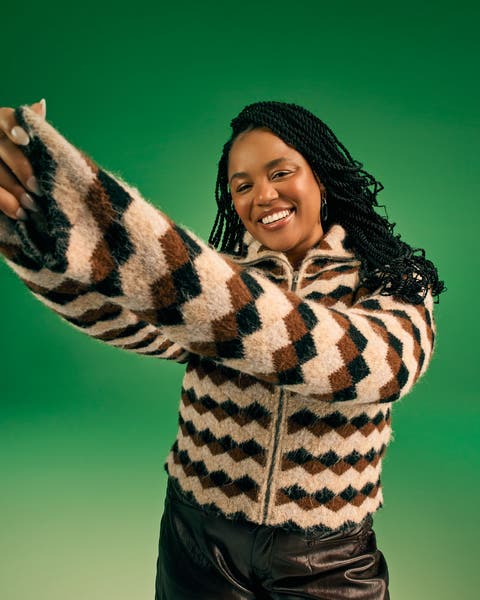 A woman in a striped sweater.