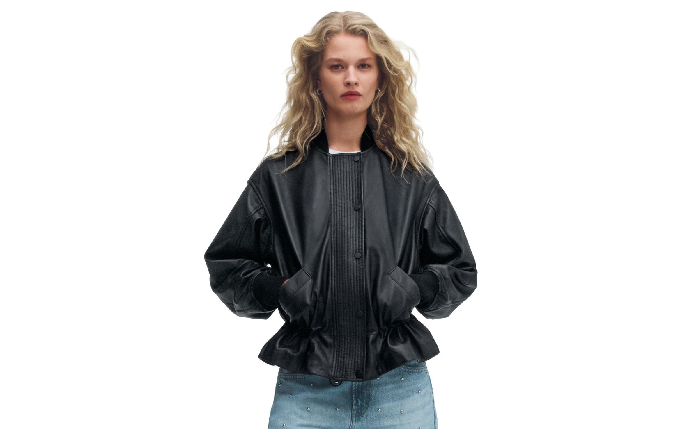 A woman wearing a leather jacket.