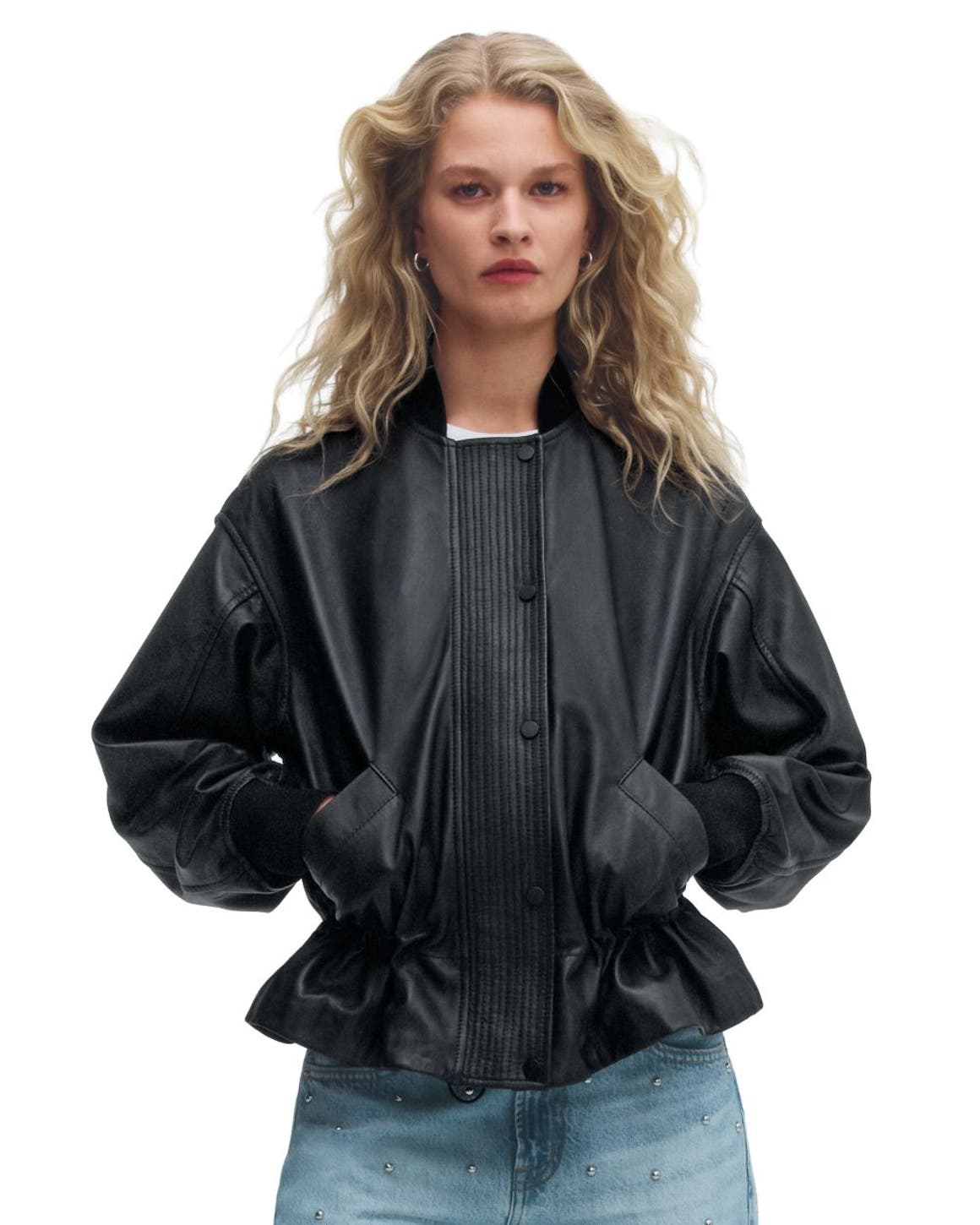 A woman wearing a leather jacket.
