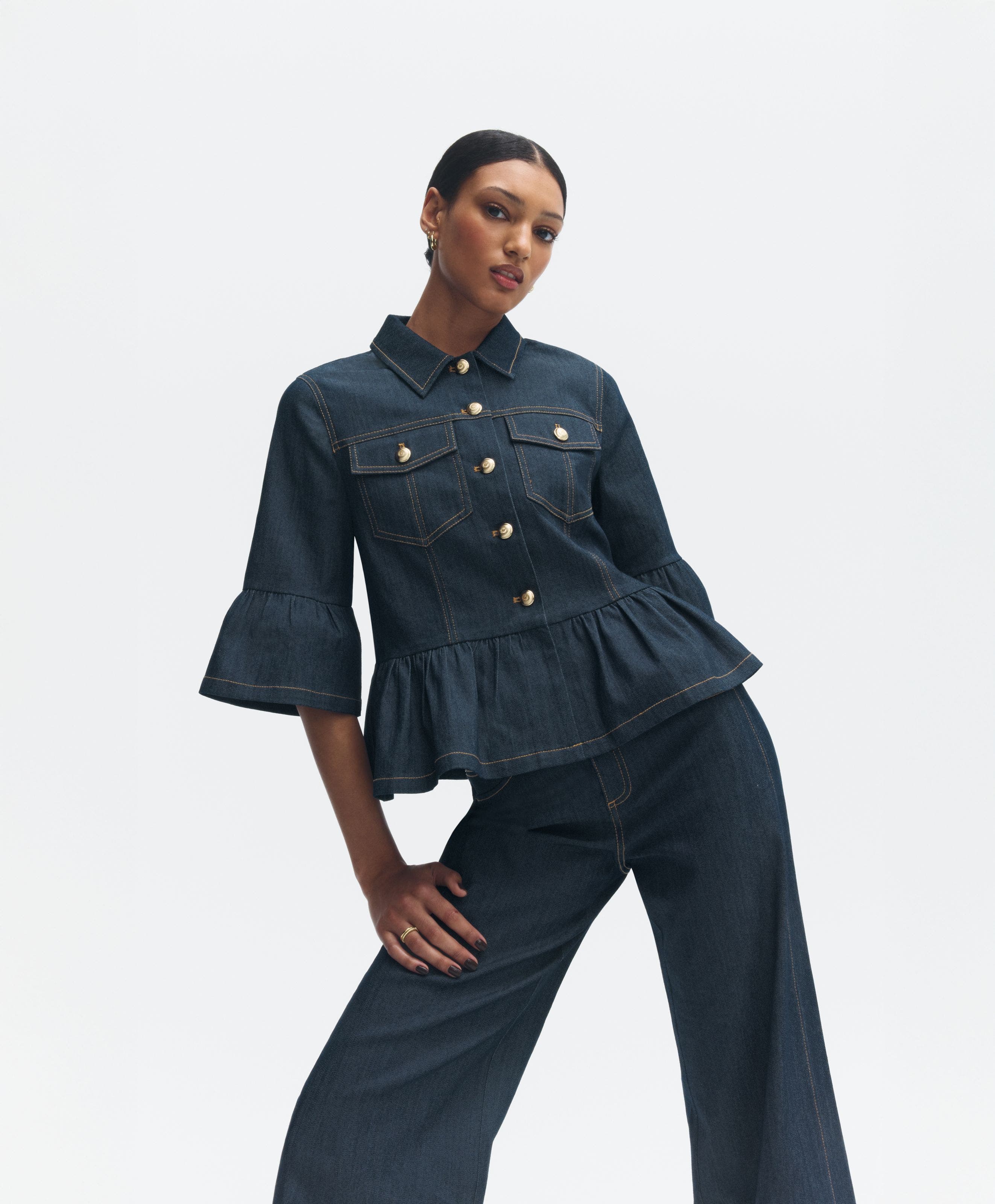Woman wearing an Anniversary Sale denim top and jeans.