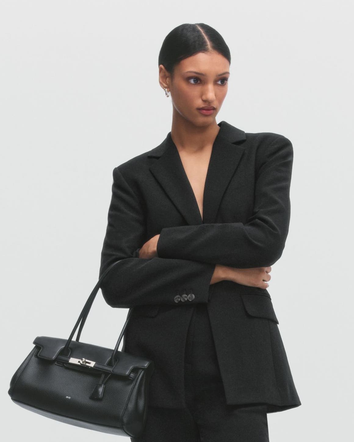 A man and woman wearing Anniversary Sale workwear styles.
