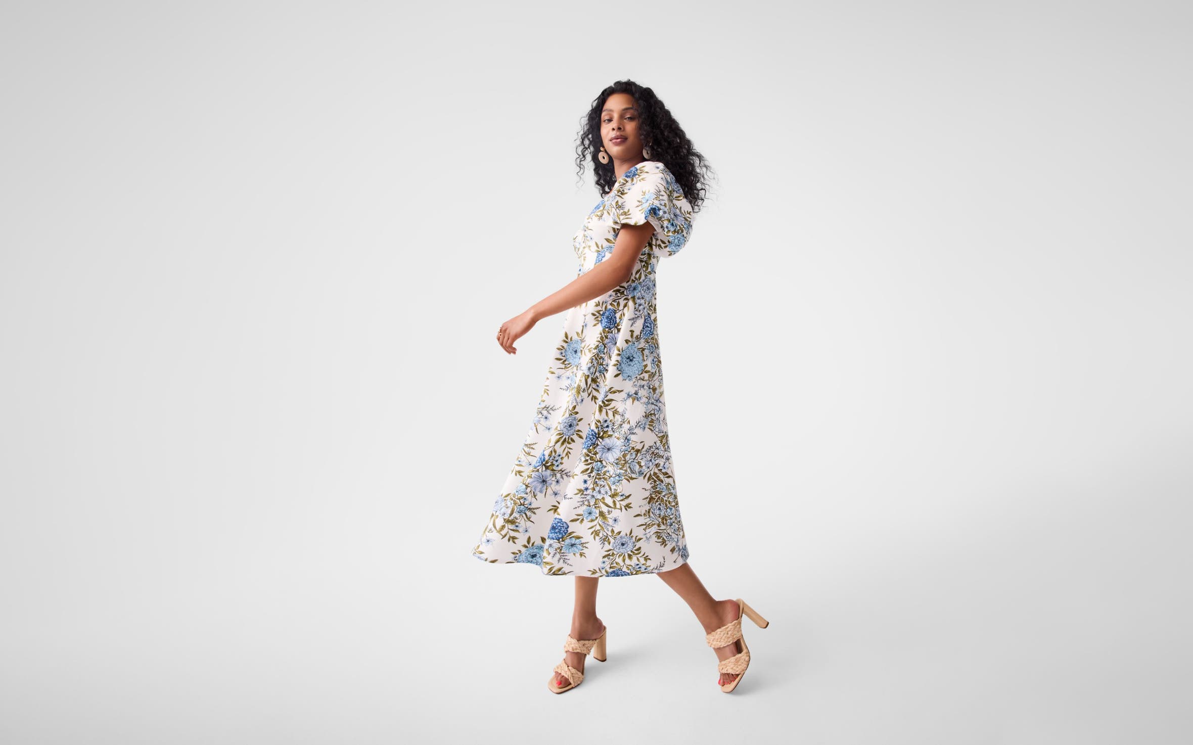 A model wearing a printed dress. 