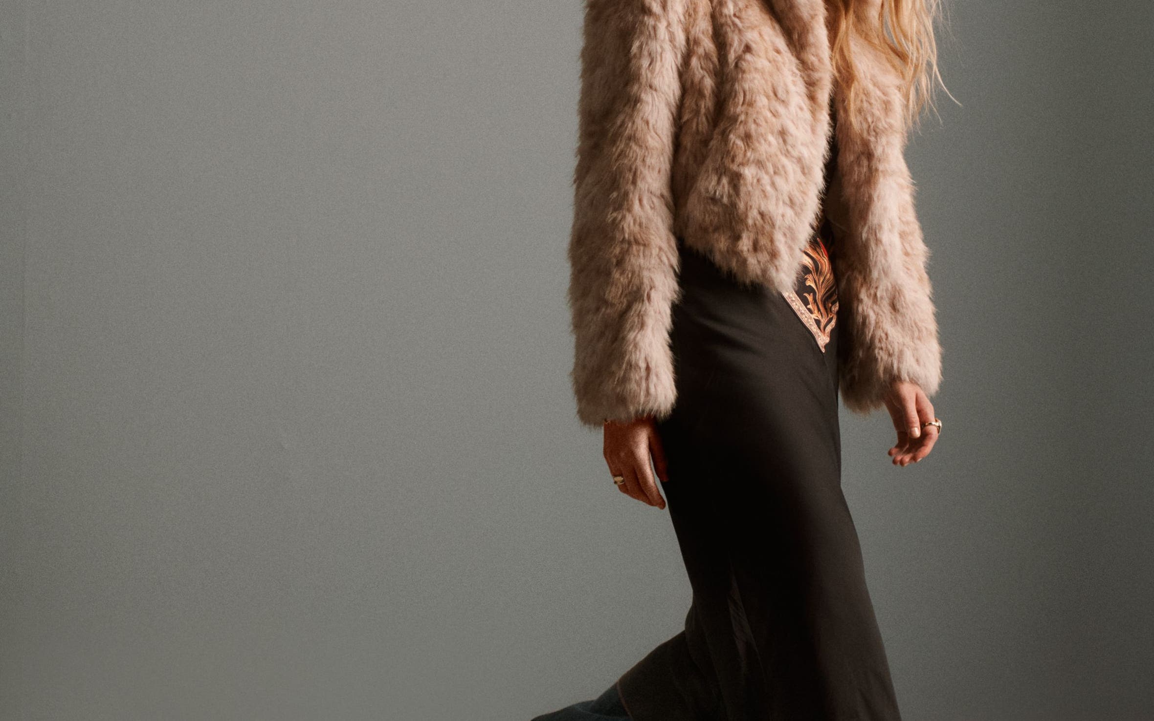 A woman wearing a faux-fur coat.