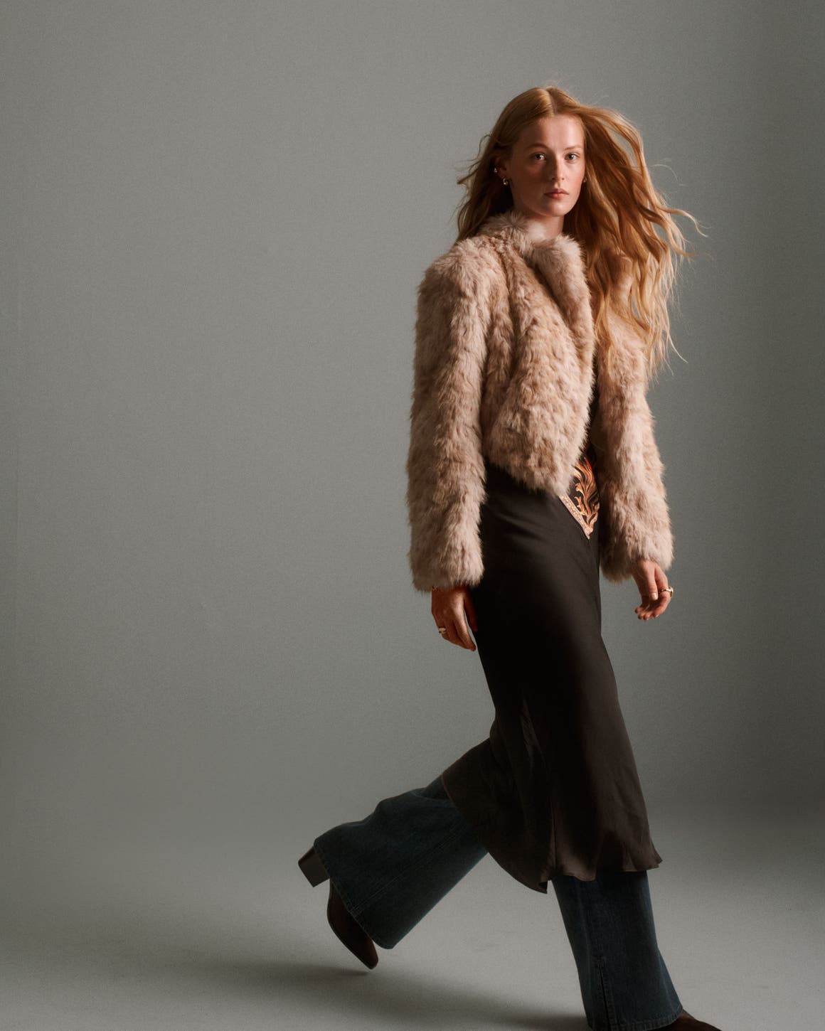 A woman wearing a faux-fur coat.