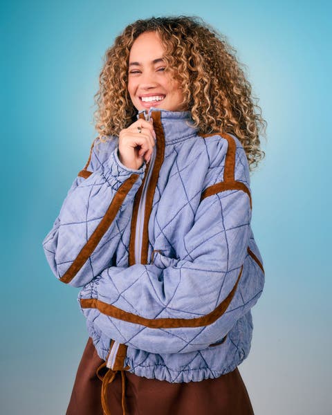 Girl in blue quilted jacket.