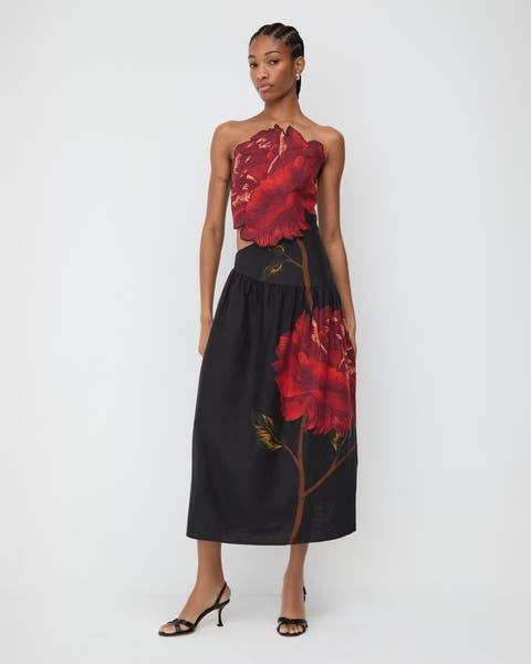 Woman wearing a floral dress.