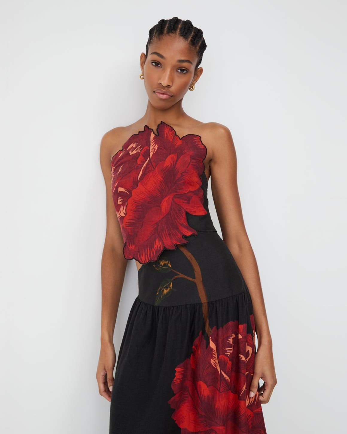 Woman wearing a floral gown.