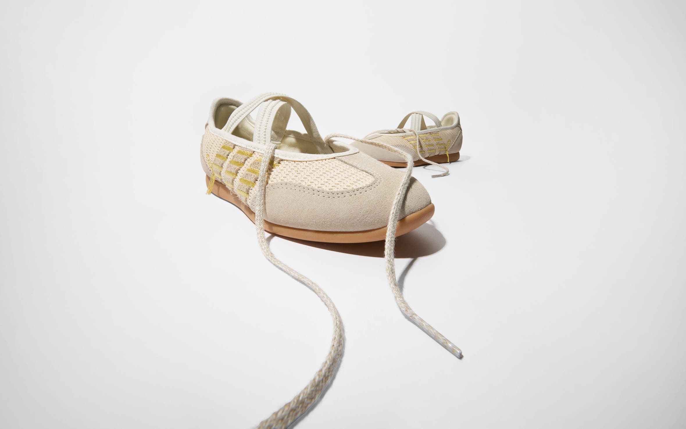 A pair of woven sneakers.