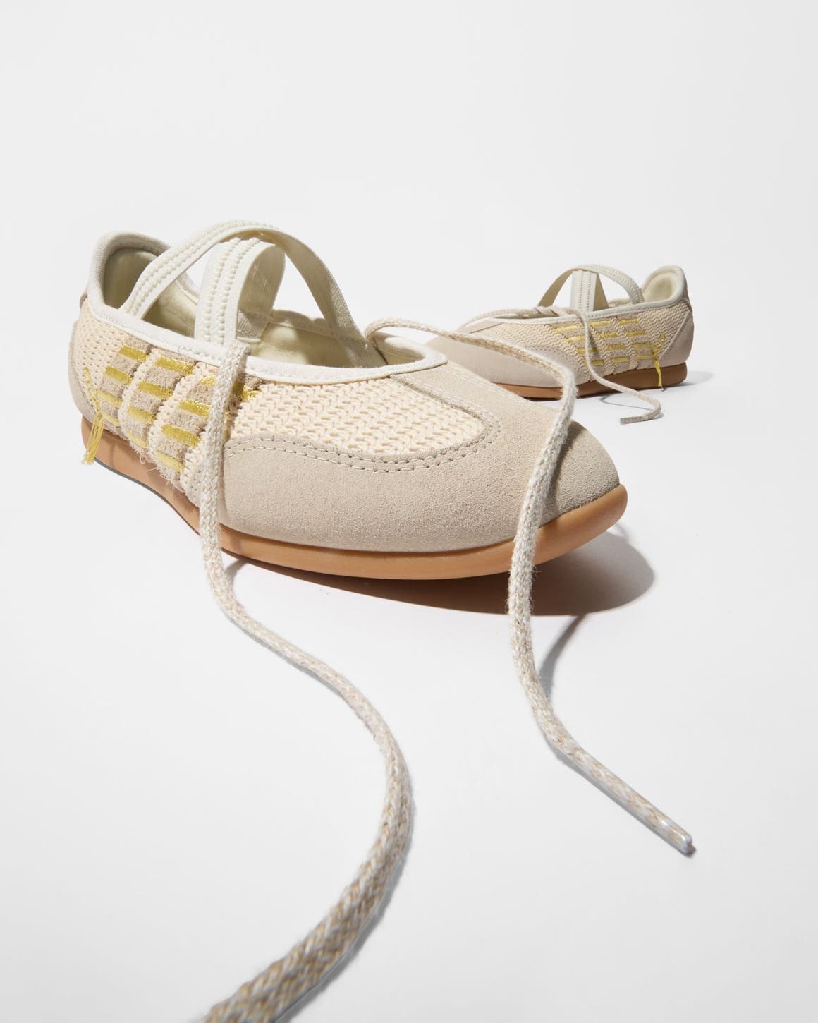 A pair of woven sneakers.