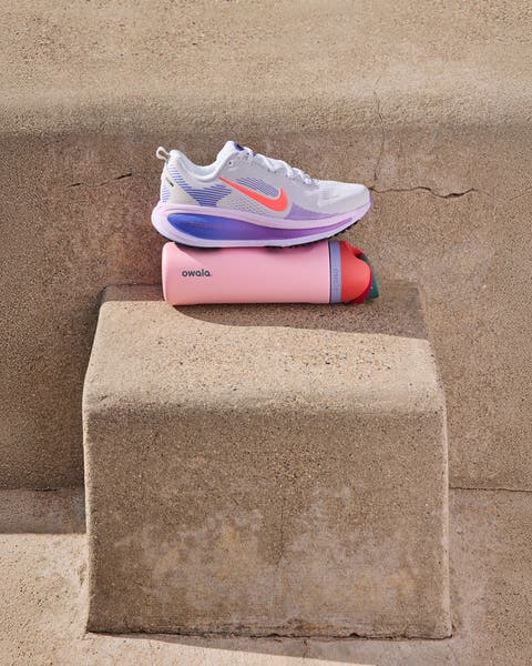 Nike sneaker and Owala water bottle.
