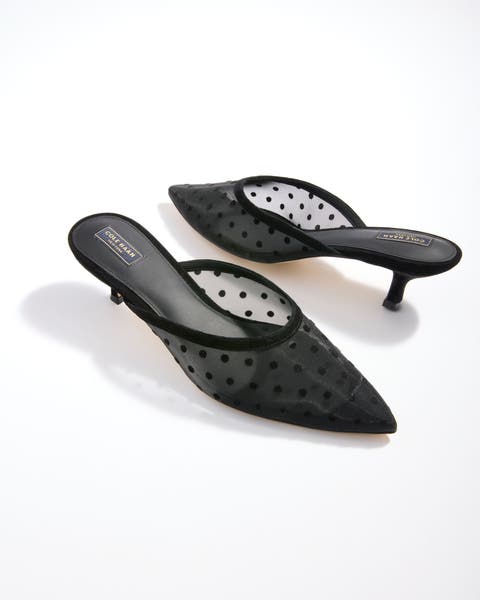 Black polka dot heeled shoes.