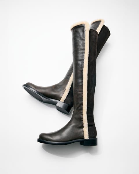 A flat lay of a pair of knee-high boots.