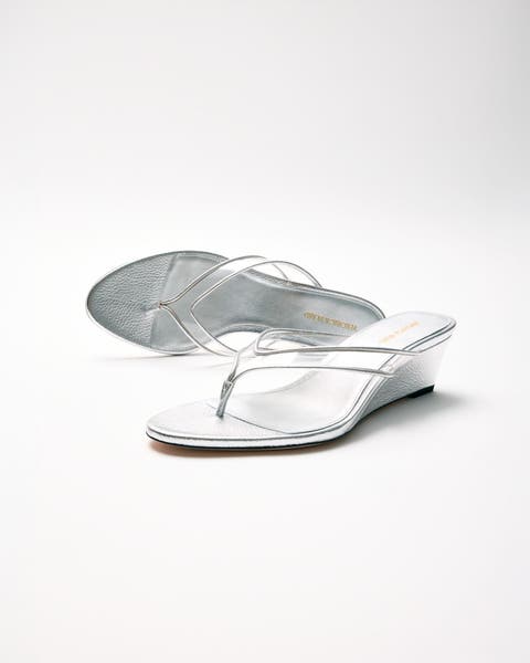 Metallic flip-flop wedge sandals.