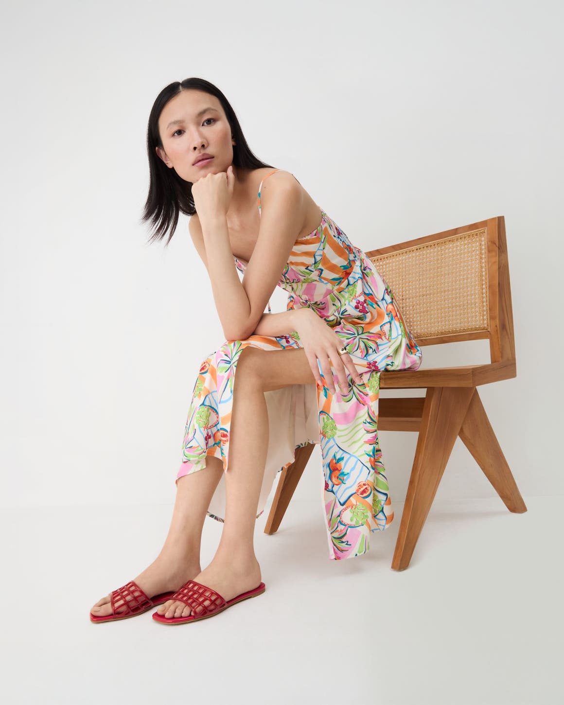 A woman wearing red jelly slides