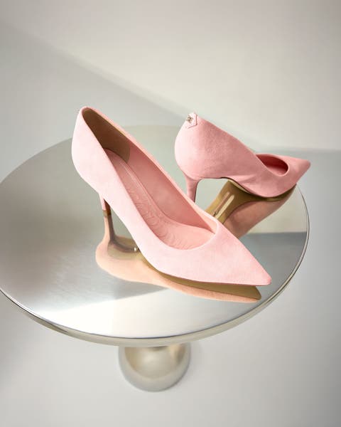 A pair of pale pink heels.
