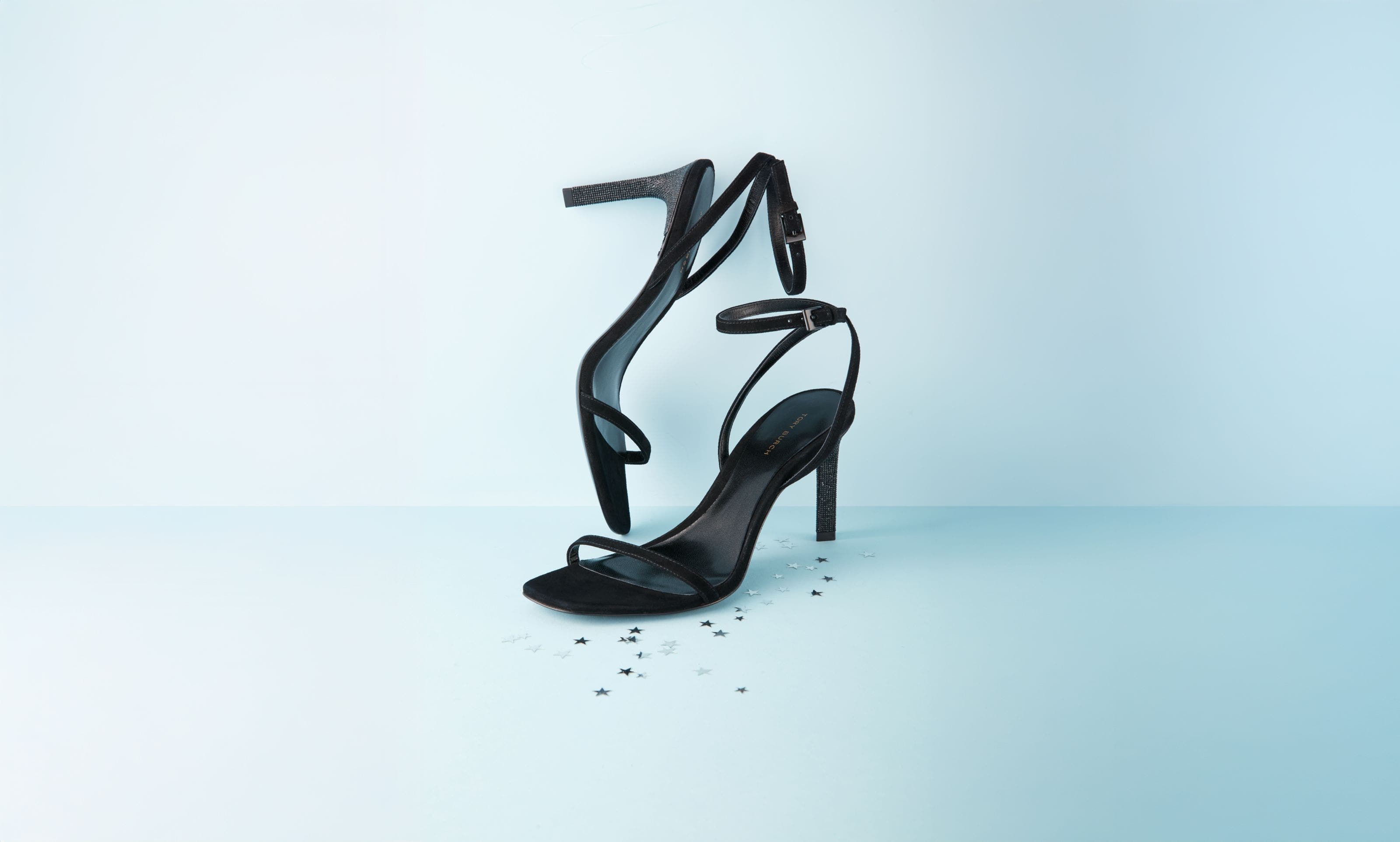 A pair of black ankle-strap heels.