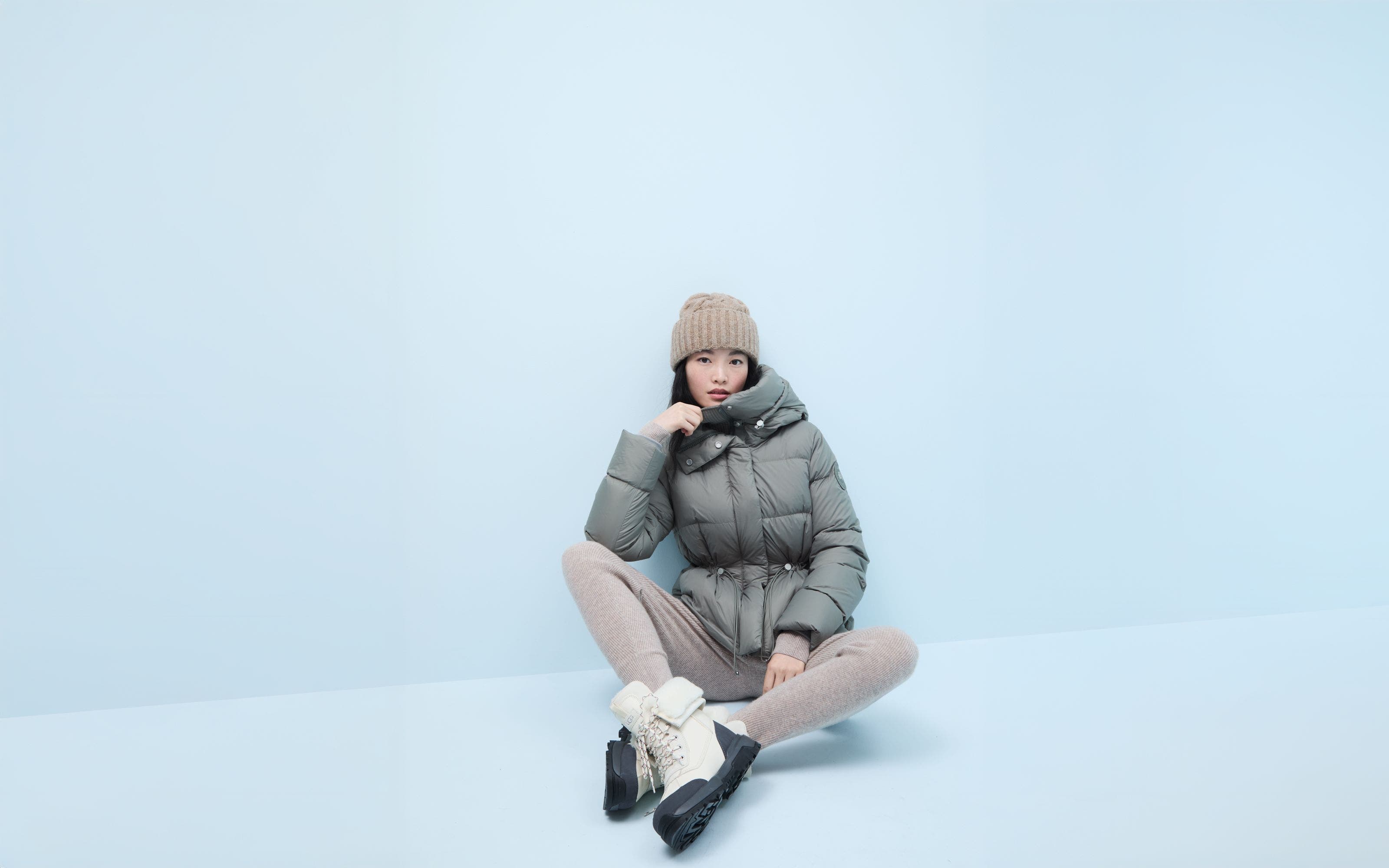 A woman wearing a puffer jacket.