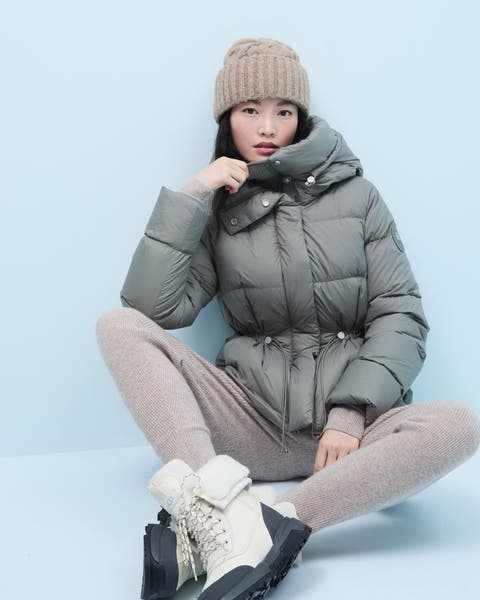 A woman wearing a puffer jacket.