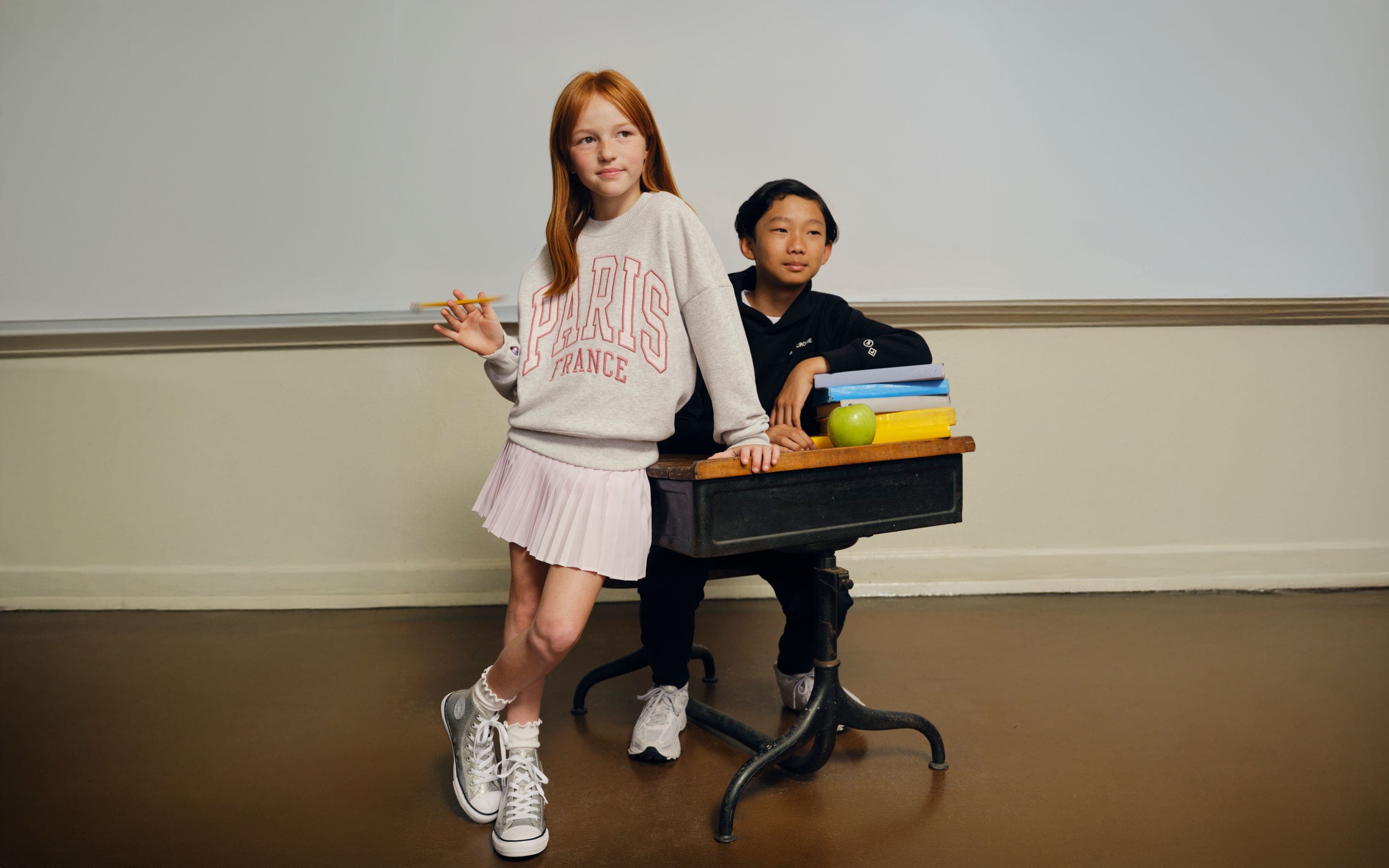 Two kids wearing Abercrombie Kids clothing.